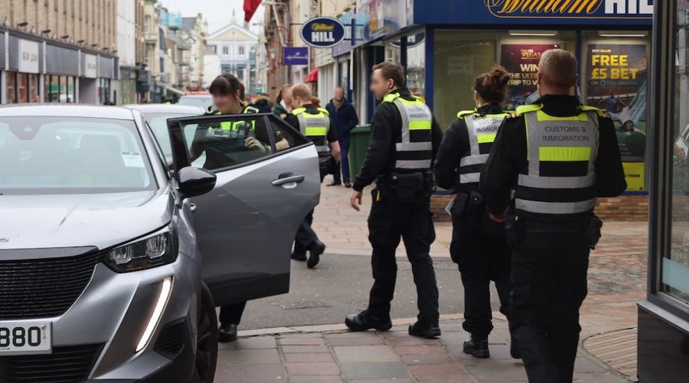 Customs_officers_getting_into_cars.jpeg