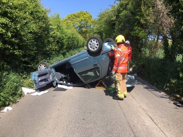 Overturned vehicle leaves driver trapped