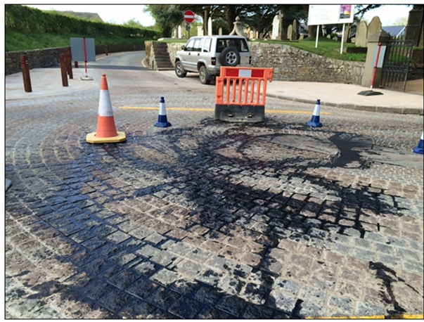 Crude protest: oil dumped on £250,000 granite crossroads