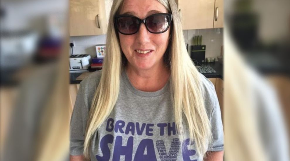 Skin cancer survivor 'braves the shave' for charity