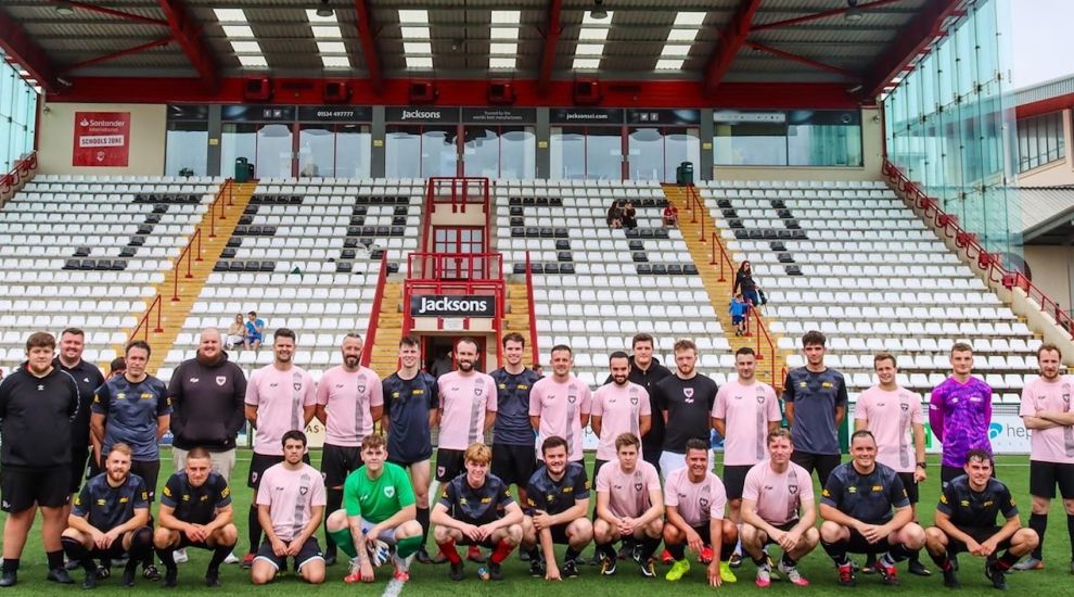 Scoring a goal for mental health with pink shirts and a football