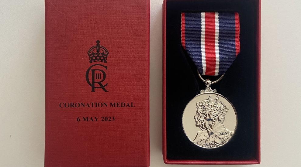 Coastguard staff receive medals from the King