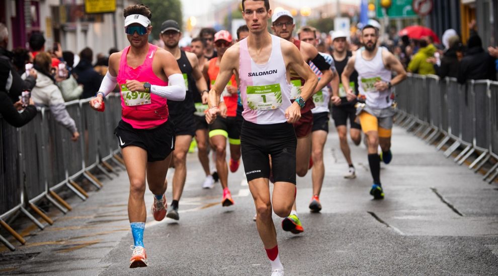 Hundreds of runners battle wet and windy conditions in Jersey Marathon