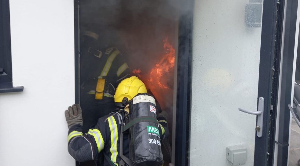 Firefighters tackle structure fire at St Saviour home