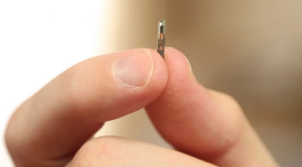US tech company offers staff microchip they can use to open doors and buy snacks