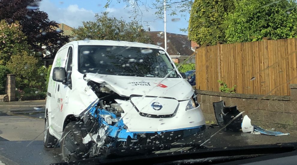 Postman escapes unharmed from two-van crash