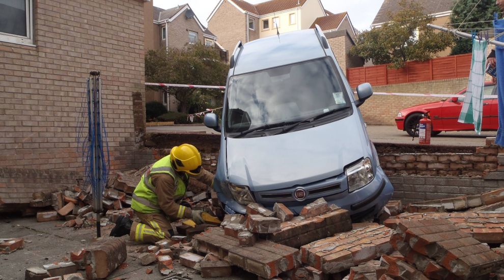 Car goes through wall