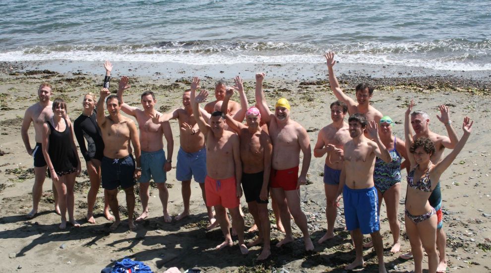 Carey Olsen lawyers take a dip in Belle Greve Bay for charity