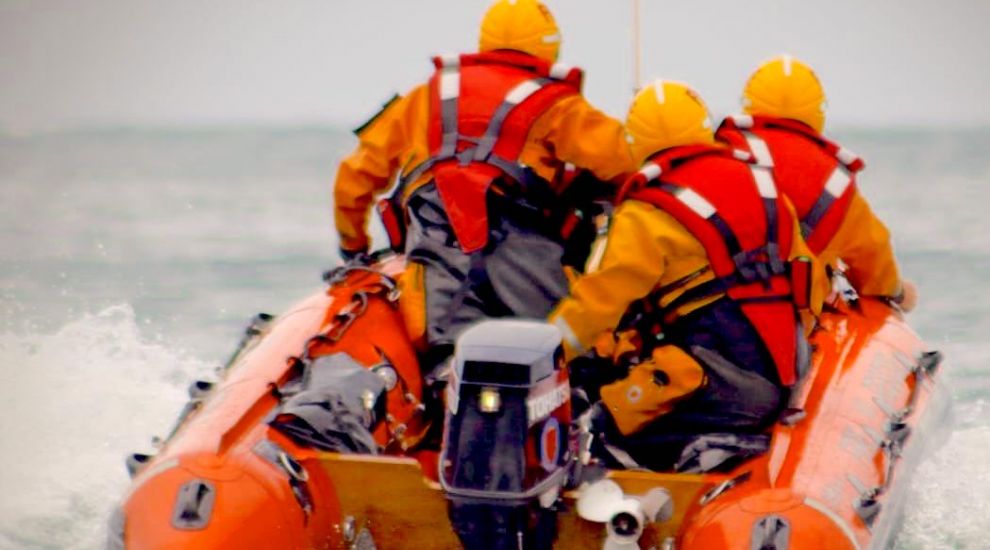 Rescue after pair trapped on rocks 600m from shore