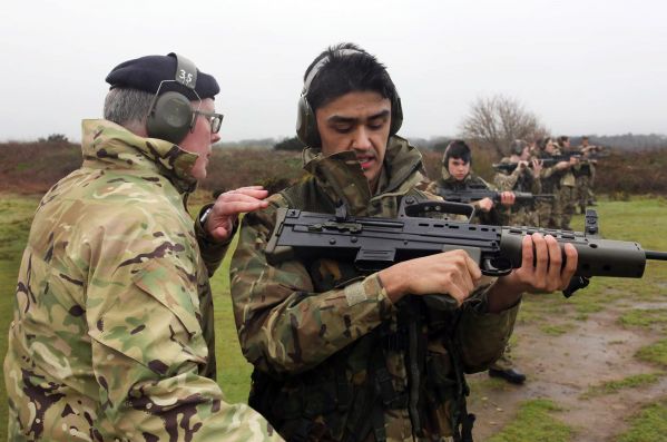 Air Cadet Kieran Le Bail has a check made on his LN98 by Army Cadet Force commanding officer Lt Chris Rayner.The Jersey Air Cadets came out on top in the annual Skill At Arms competition held at Crabbe on Sunday..Picture: LEIGHTON JENKINS..