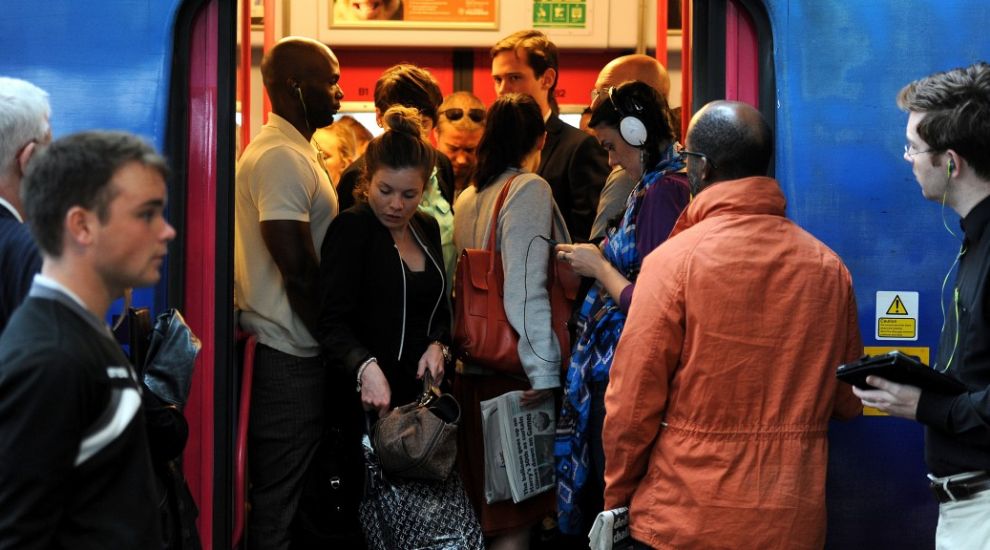 Wearing headphones is about ignoring strangers on the daily commute, a survey claims