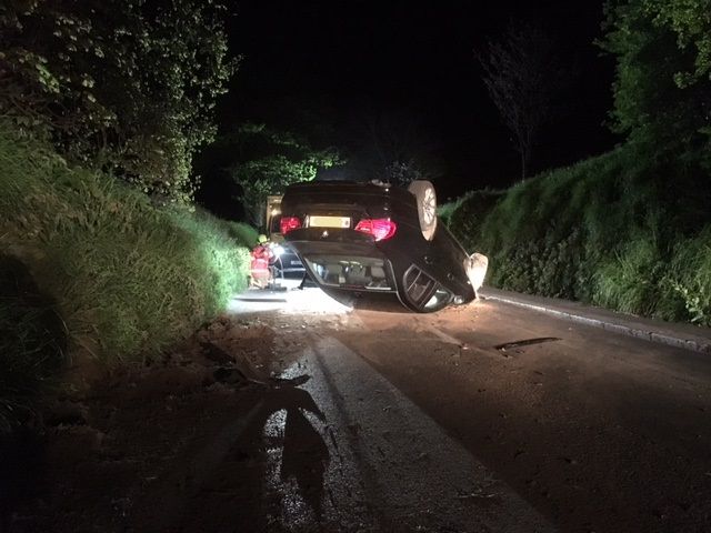 Overturned car leaves driver trapped