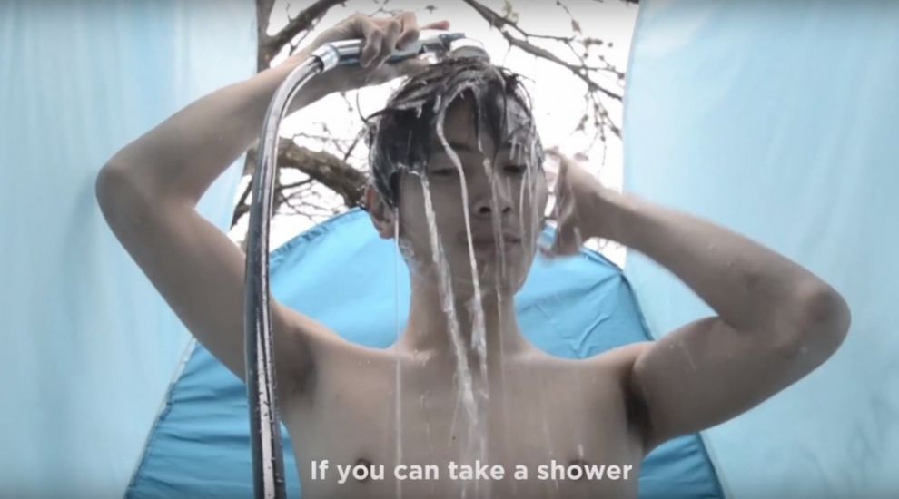 This portable shower uses the same water for two weeks