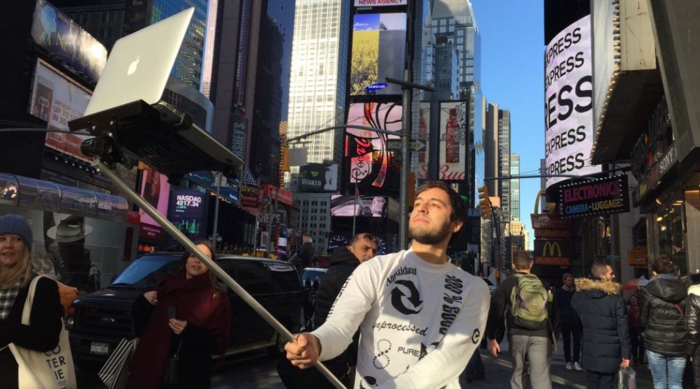 Humanity, we've reached the pinnacle: Presenting the Macbook selfie stick