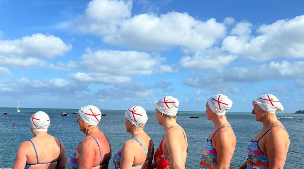 Relay team successfully completes 36-mile round-island swim