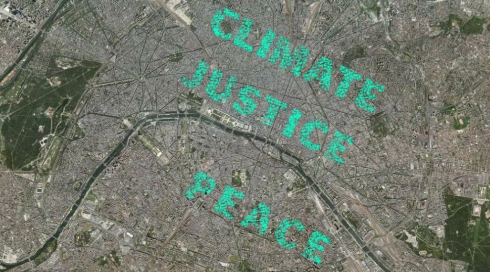 Thousands of people in Paris spell out a message for climate justice using geolocation